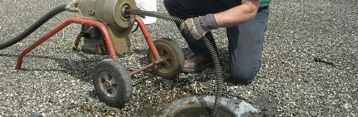 sewer rodding technician actively removing blockages from a sewer line in Evansville, IN