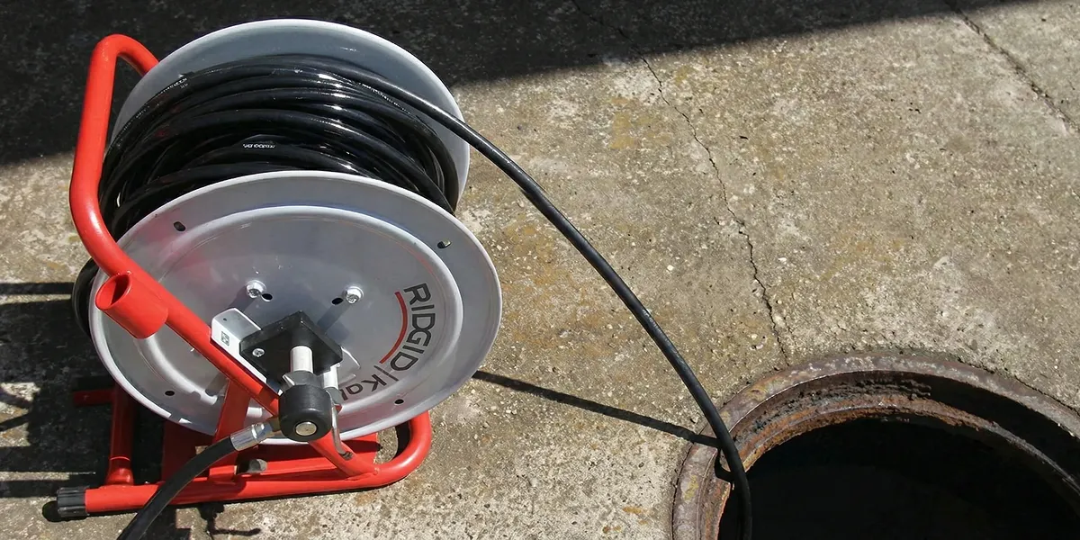 sewer rodding equipment prepared to clear clogged sewer lines in Evansville, IN